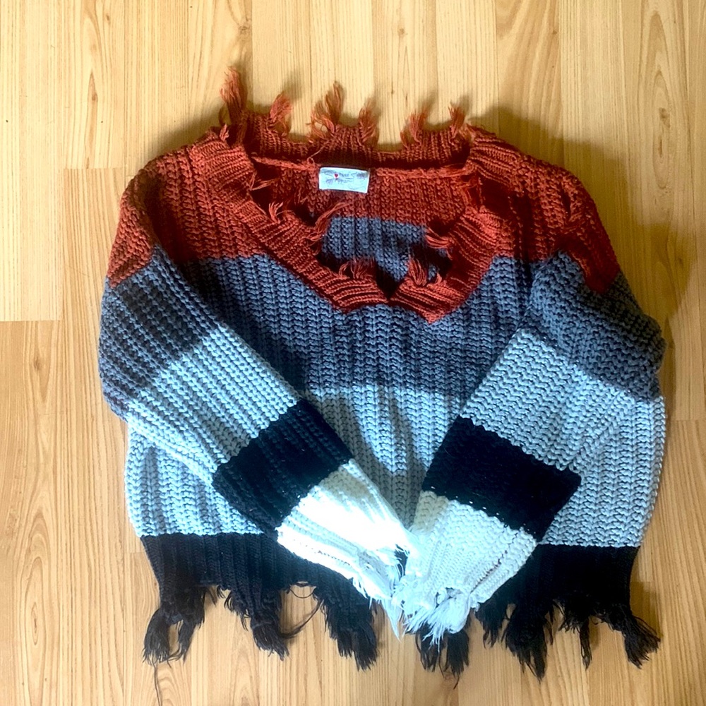 Multicolor sweater with purposeful rips